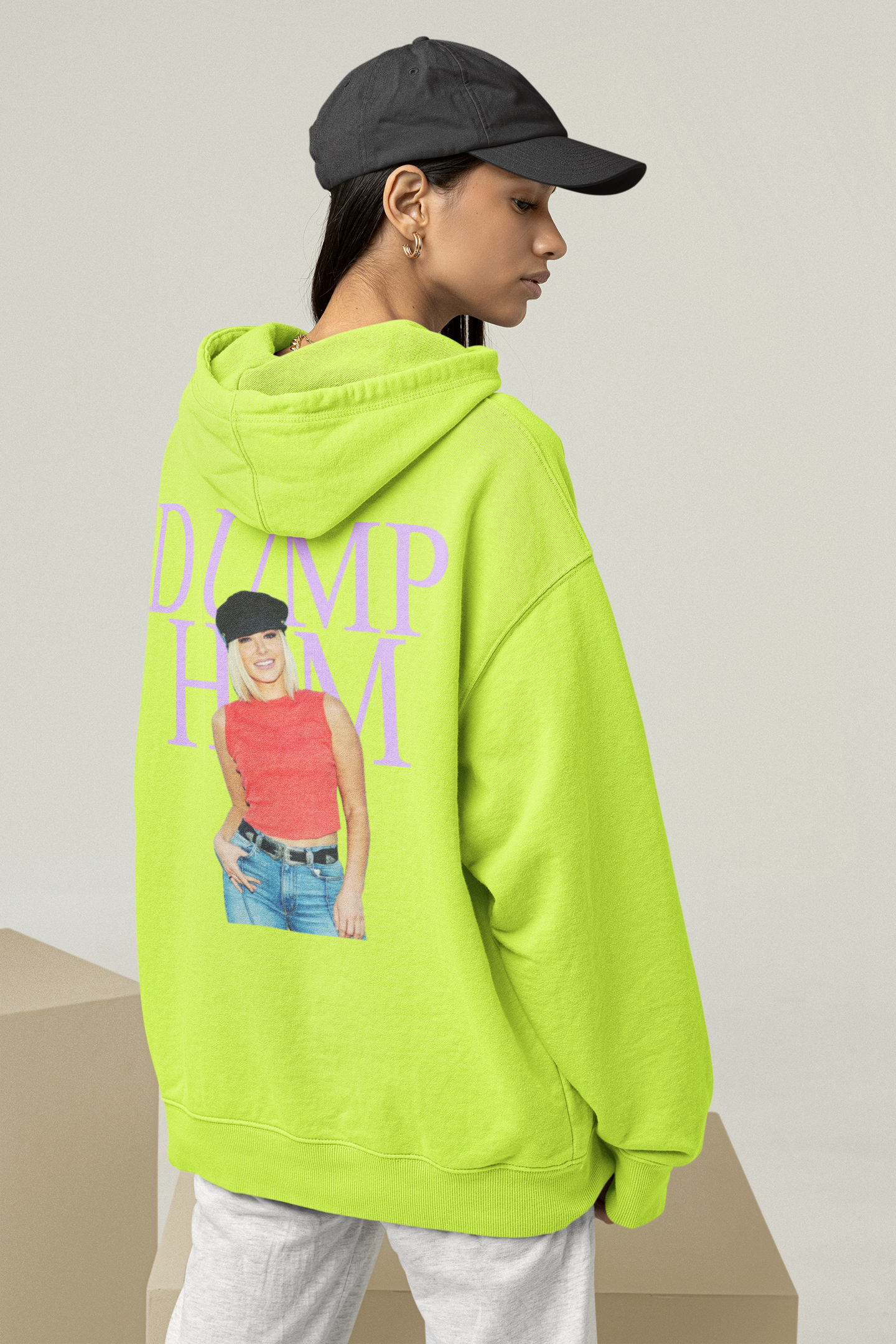 mockup-of-a-woman-wearing-an-oversized-hoodie-with-customizable-sleeves-at-a-studio-m26170.png